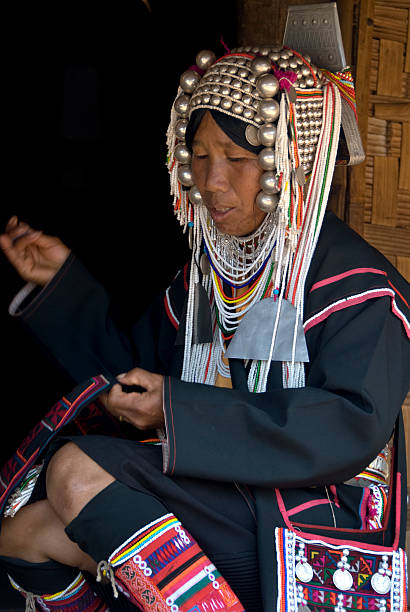 istock Akha Woman Hand Sewing 471076819