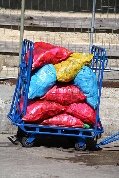 istock Cart full of garbage bags 471076863