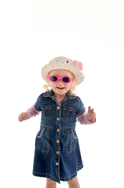 istock two year old girl with sunglasses and hat 471077397