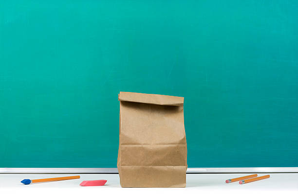 istock Packed Lunch in Front of Chalkboard 471078659