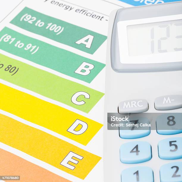Colorful Energy Efficiency Chart And Calculator Close Up Shot Stock Photo - Download Image Now