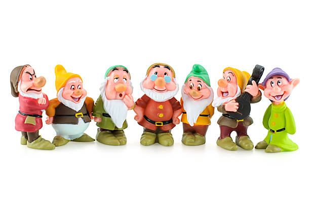 Group of the Seven Dwarfs toy figure. Bangkok,Thailand - April 19, 2015: Group of the Seven Dwarfs toy figure. The character appeared in Disney's Snow White and the Seven Dwarfs. snow white and the seven dwarfs photos stock pictures, royalty-free photos & images