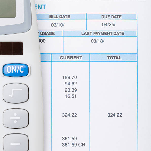 istock Neat calculator and utility bill - close up shot 471078742