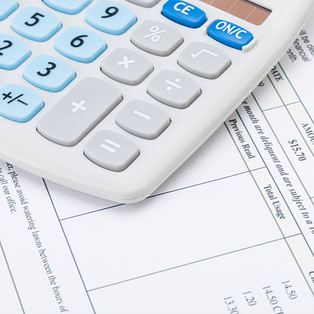 istock Calculator with monthly utility bill - close up shot 471078750