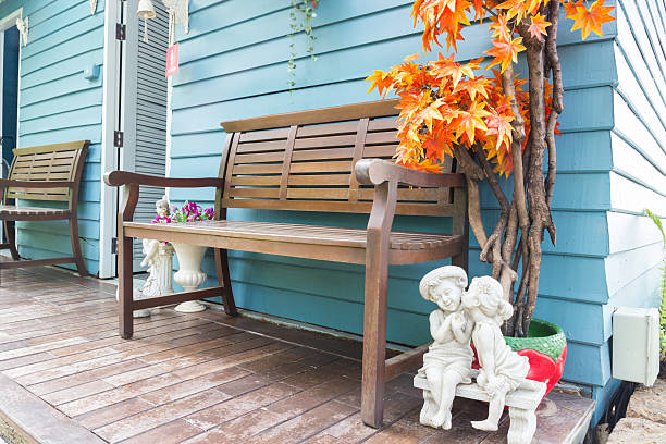 istock wooden bench in front of blue wall 471078978
