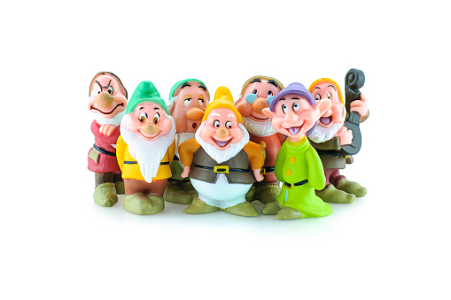 Bangkok,Thailand - April 19, 2015: Group of the Seven Dwarfs toy figure. The character appeared in Disney's Snow White and the Seven Dwarfs.