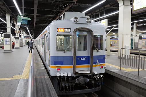 Osaka, Japan - April 13, 2015: People at Namba Station in Osaka, Japan. This train is operated by Nankai Electric Railway going to Wakayamako.