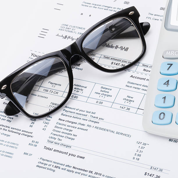 istock Calculator and glasses with utility bill - close up shot 471079592