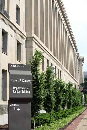 Government sign and office building, Washington DC, USA