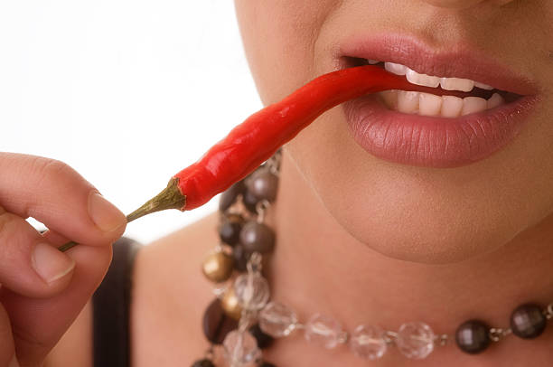 tasting chilli stock photo