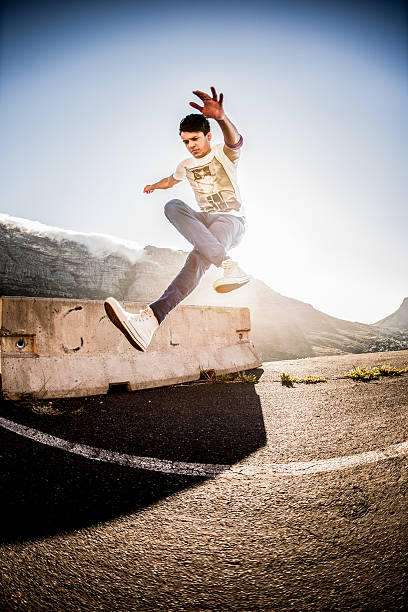 istock Hispanic b-boy practicing his parkour and breakdancing moves 471080180