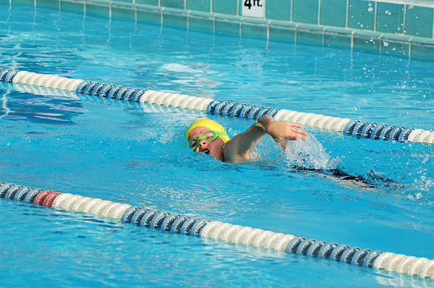 istock Young Boy Freestyle Swimmer 471081963
