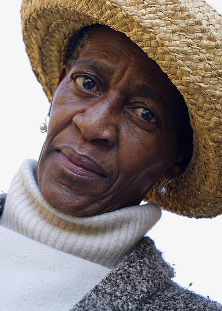 istock African woman in a straw hat 471082545