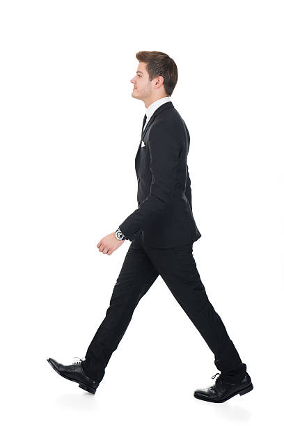 istock Side View Of Confident Businessman Walking 471083414