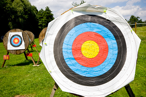 Archery targets on green summer meadow waiting for the archery competition. Archery competition sport.