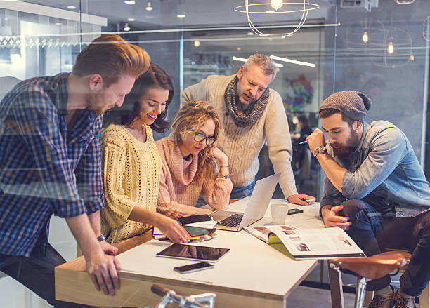 istock Group of happy creative people working together in the office. 471083544