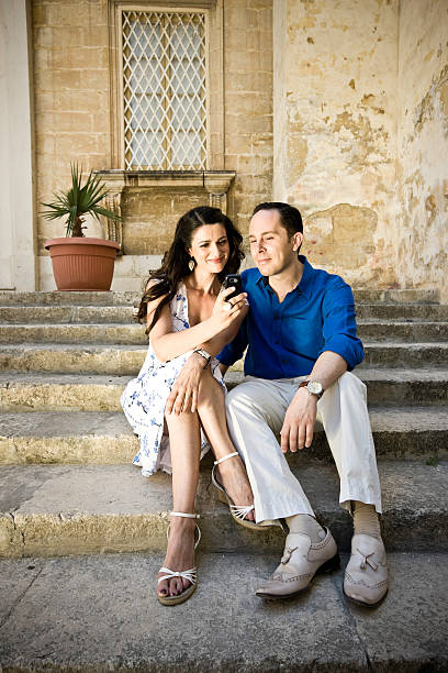 istock woman and man reading text message together 471083581