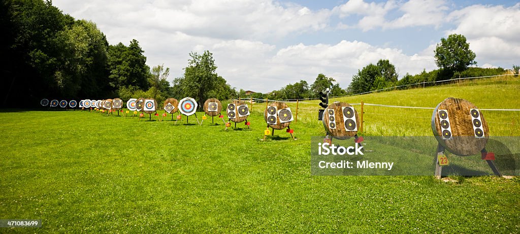 archery targets (large group) panoramic large group of archery targets standing in different distances on green summer meadow waiting for the archery training. panoramic. canon 1Ds MK III. Archery Stock Photo