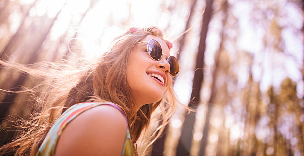 istock Boho girl in sunglasses in a summer forest 471084330