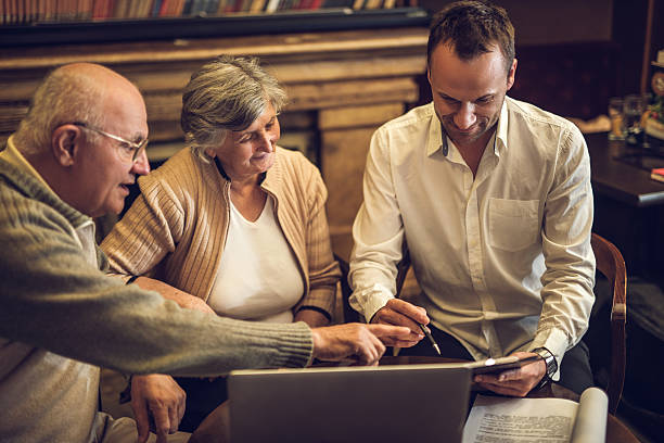 istock Old couple talking in a meeting with consultant 471084582