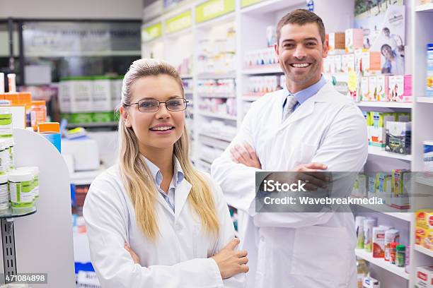 Team Of Pharmacists Smiling At Camera Stock Photo - Download Image Now - 20-24 Years, 20-29 Years, 2015