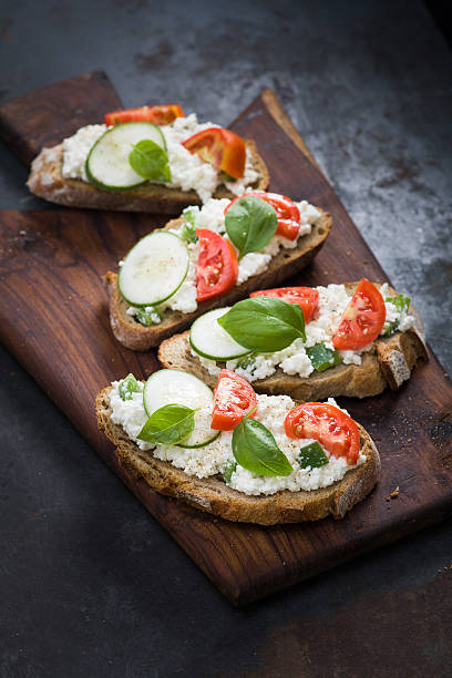 Bruschetta with tomato, basil, cottage cheese and bell pepper stock photo