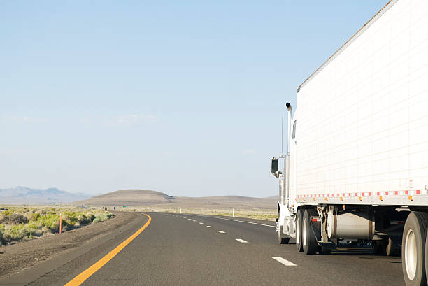 istock Big White Truck Empty Road 471086983
