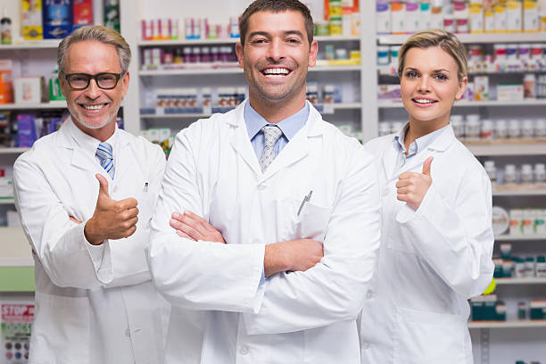 istock Team of pharmacists smiling at camera 471088328