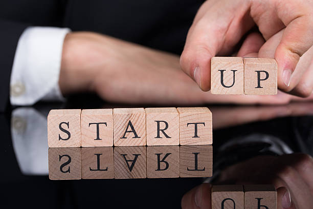 istock Businessman Arranging Startup Blocks On Desk 471088432