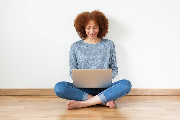 istock Black African American student girl using a laptop 471088730