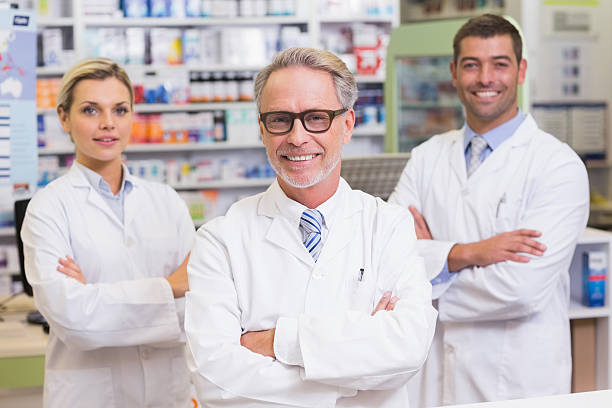 istock Team of pharmacists smiling at camera 471088862
