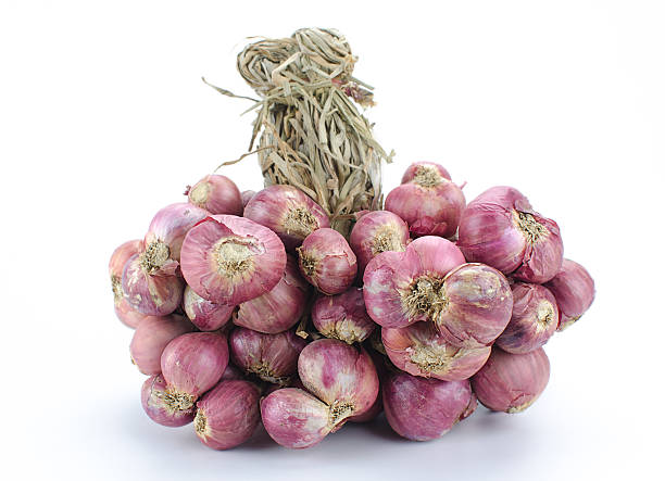 istock Shallot onions in a group on white background 471089250