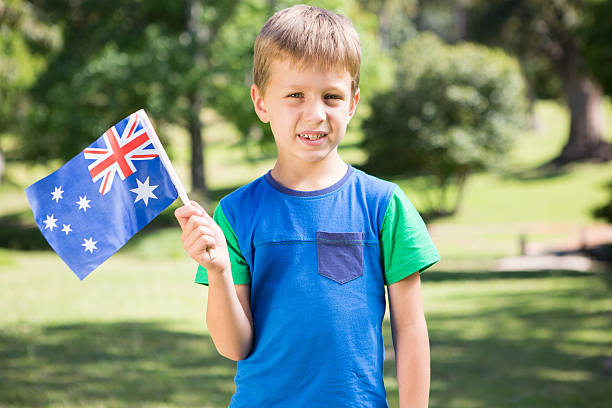 istock Little boy waving australian flag 471089298