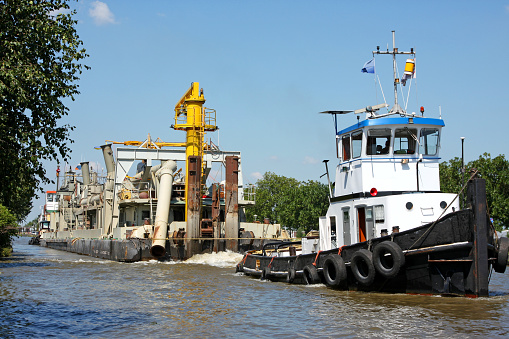 Tugboat with dredger, please see also my other images of the city of Rotterdam in my lightbox:
