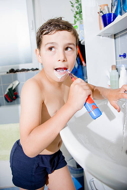 istock Cute boy brushing his teeth, Dental Care 471089775