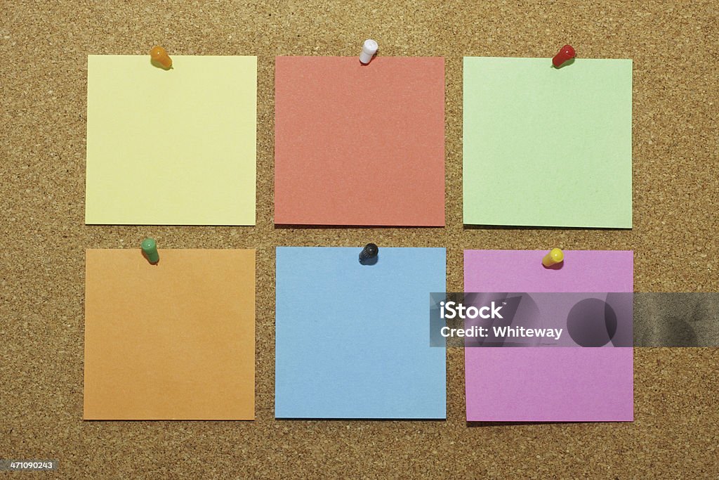 Six blank Post-It notes pinned to noticeboard various colours notelets Six squares of coloured Post-It note paper on a cork notice board - a casual way to introduce two points for a report or presentation. Adhesive Note Stock Photo