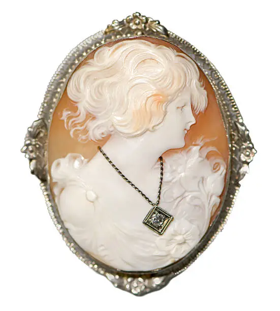 Well defined antique Italian shell cameo of a beautiful girl wearing a white gold chain necklace with a diamond gemstone.