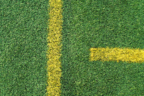 istock Green Artificial Turf on Football Field with Yellow Stripe 471093469