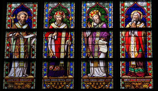 Stained Glass Window depicting Saint Basil of Caesarea, Gregory of Nazianzus, John Chrysostom and Athanasius of Alexandria in Den Bosch Cathedral, The Netherlands. This window was created before 1895, no property release is required.