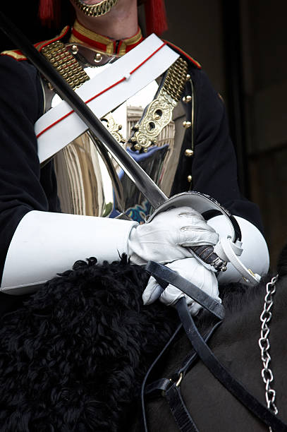 istock Regimental soldier with sword on horse 471098447