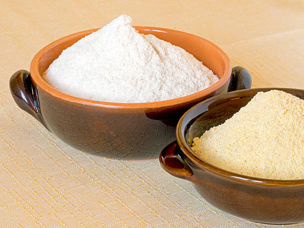 istock Wheat and maize flour in bowls 471098648