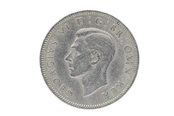 British Coin - 1947 Shilling Of George VI A British shilling from 1947.  This is the obverse of the coin showing the profile of King George VI. george vi stock pictures, royalty-free photos & images