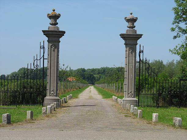 istock Gate with iron fence and driveway 471099297
