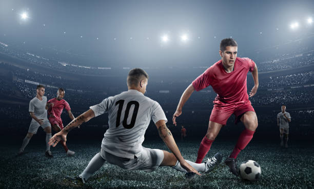 istock Soccer player kicking ball in stadium 471099514