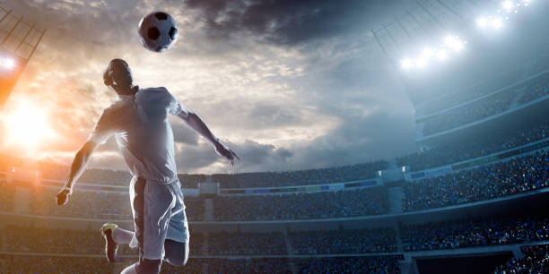 istock Soccer player kicking ball in stadium 471099594