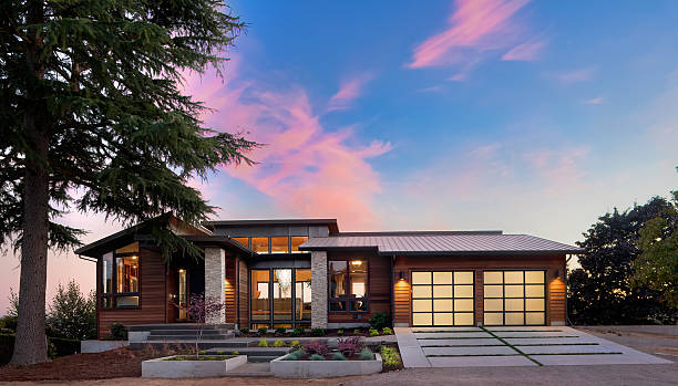 Beautiful Exterior of New Luxury Home at Twilight stock photo