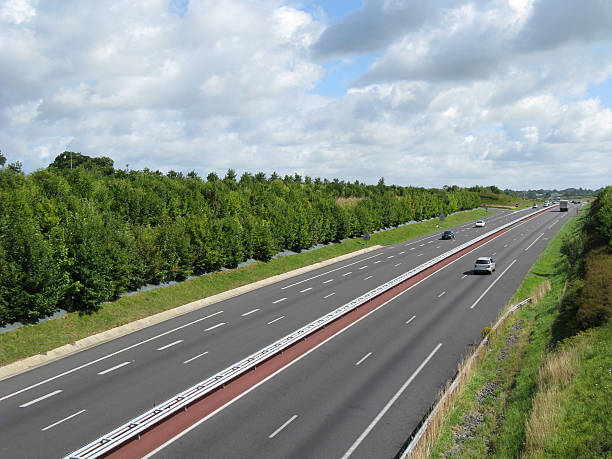 istock 4 lane highway with red divider between north and south lane 471101357