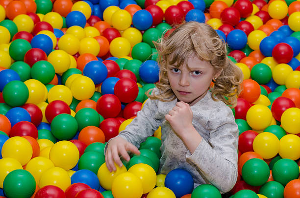 istock happy girl playing with balls 471101416