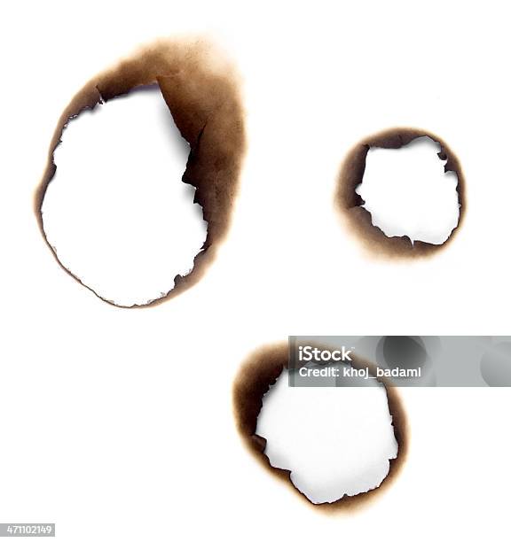 Burnt Holes In A Piece Of Paper Stock Photo - Download Image Now - Paper, Burnt, Burning