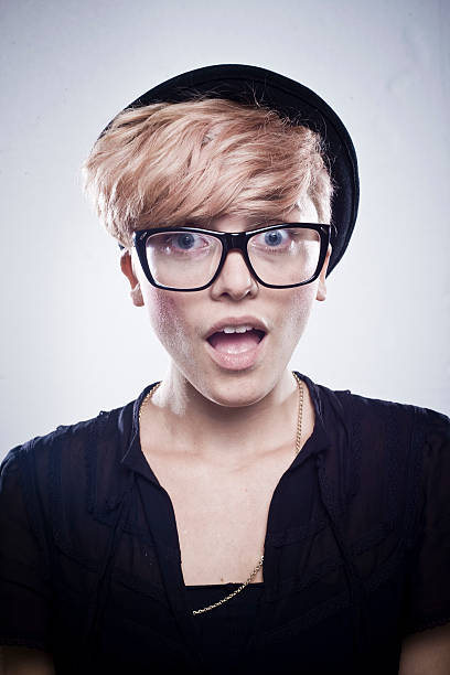 Shock! Young attractive girl wearing specs with shocked expression horn rimmed glasses stock pictures, royalty-free photos & images